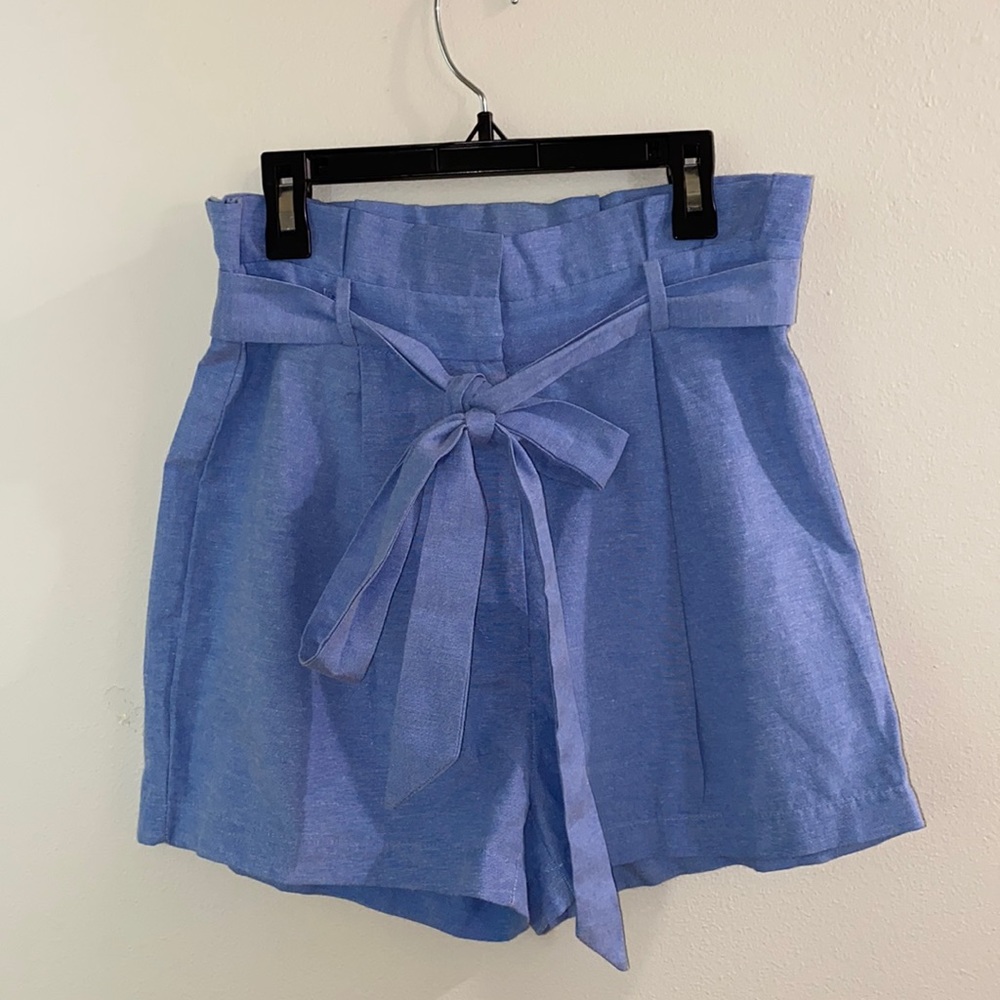 Blue high waisted tie shorts from St. Bernard.